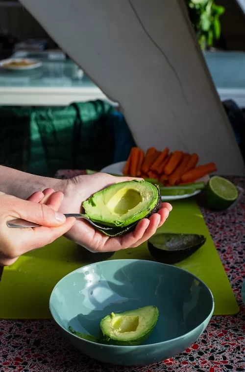 scooping an avocado